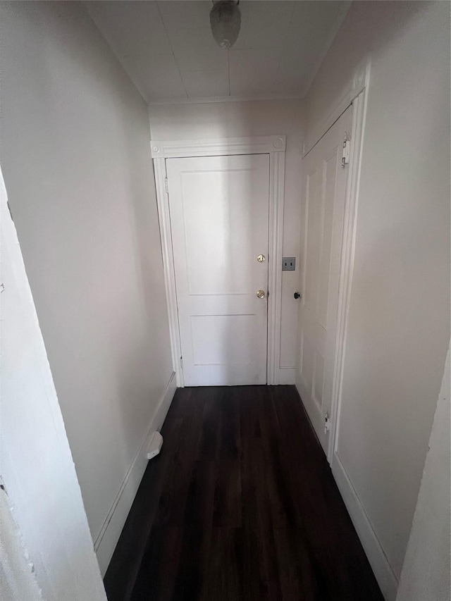 corridor featuring dark hardwood / wood-style floors