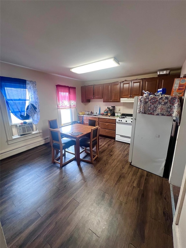 kitchen featuring baseboard heating, dark hardwood / wood-style flooring, cooling unit, and white appliances