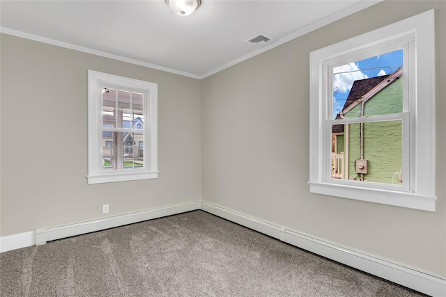 empty room with carpet flooring, ornamental molding, and a wealth of natural light