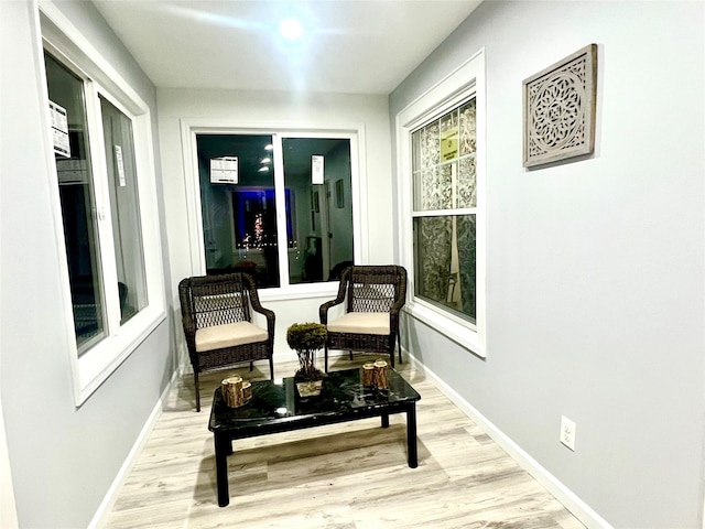 living area with light hardwood / wood-style flooring