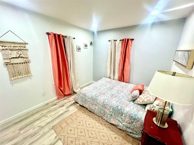 bedroom with light hardwood / wood-style floors