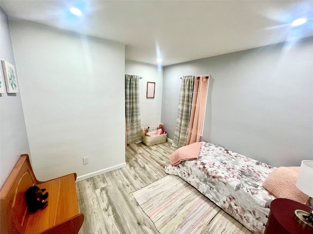 bedroom featuring light wood-type flooring