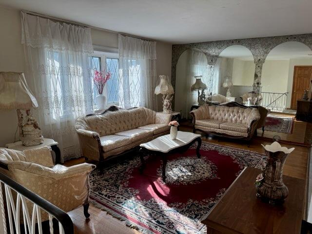 living area with hardwood / wood-style floors