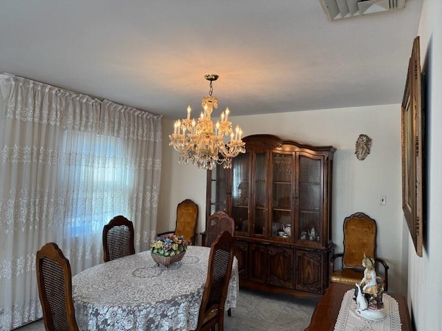 dining space with a notable chandelier