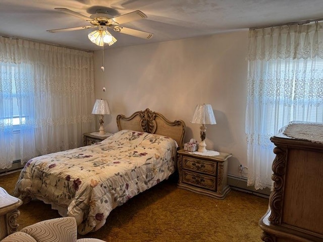 bedroom with ceiling fan, carpet, and a baseboard radiator