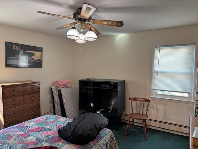 bedroom with dark carpet, ceiling fan, and a baseboard heating unit