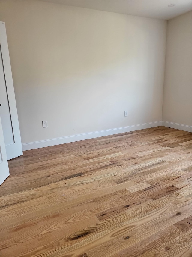 spare room featuring light wood-type flooring