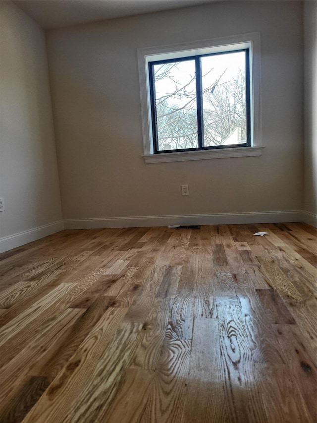 unfurnished room featuring light wood-type flooring