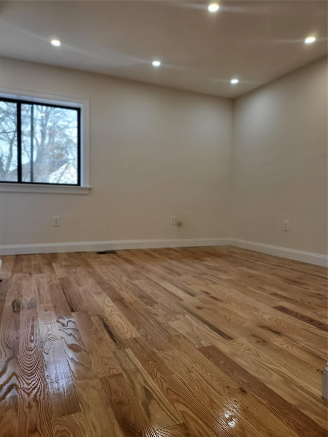 spare room with light hardwood / wood-style floors