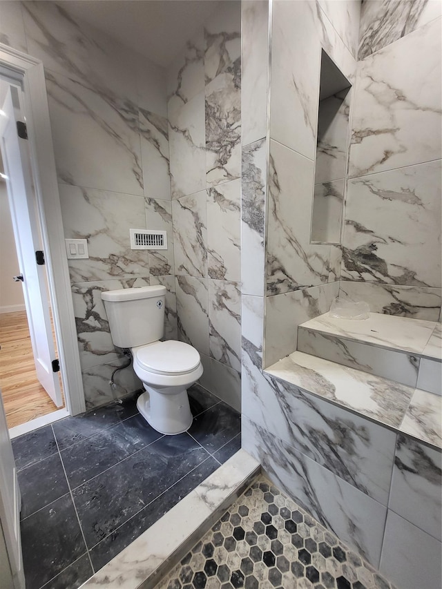 bathroom with wood-type flooring and toilet