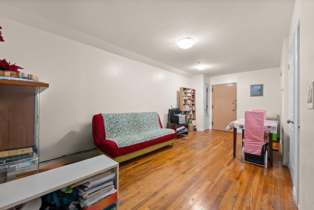 sitting room with wood-type flooring