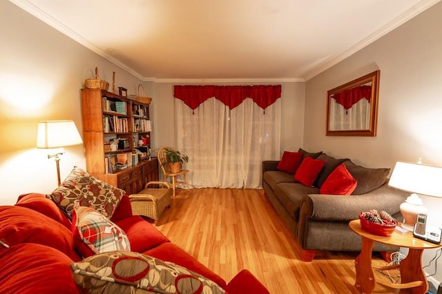 living room featuring crown molding and light hardwood / wood-style floors