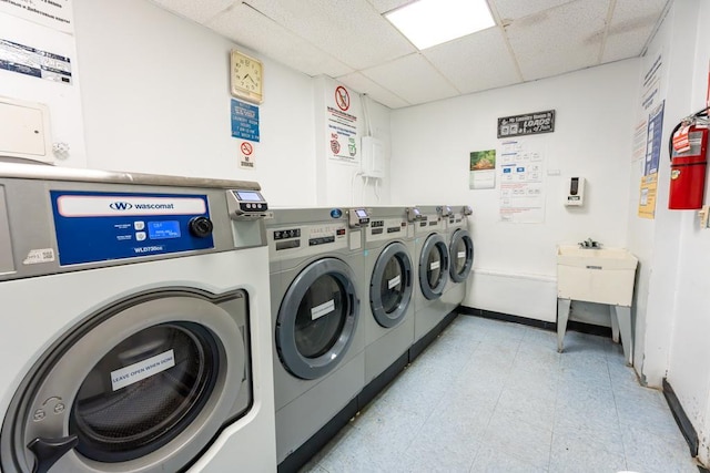 clothes washing area featuring washing machine and clothes dryer