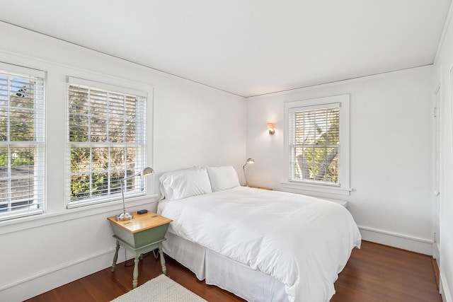 bedroom featuring dark hardwood / wood-style floors