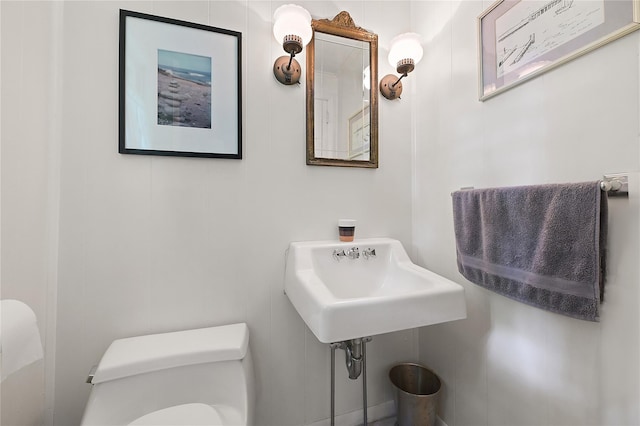 bathroom featuring toilet and sink