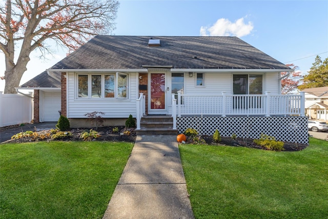 view of front of house with a garage and a front yard