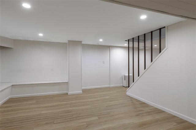 basement featuring light hardwood / wood-style floors