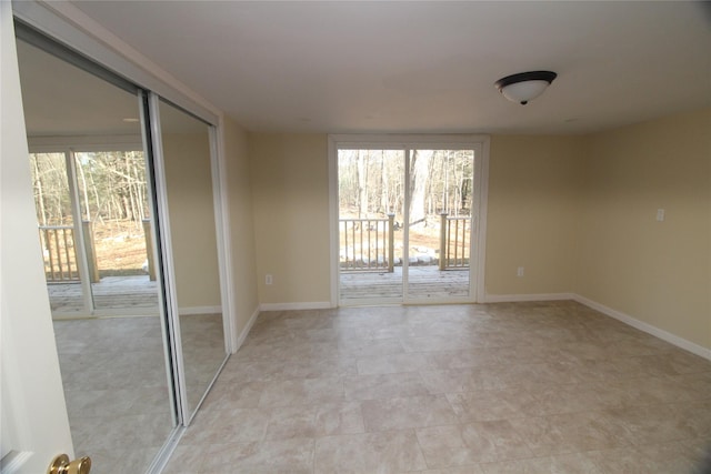 unfurnished room featuring a healthy amount of sunlight