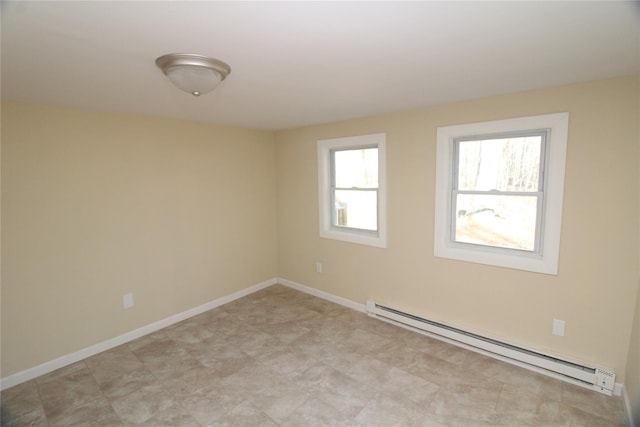 empty room with plenty of natural light and a baseboard heating unit