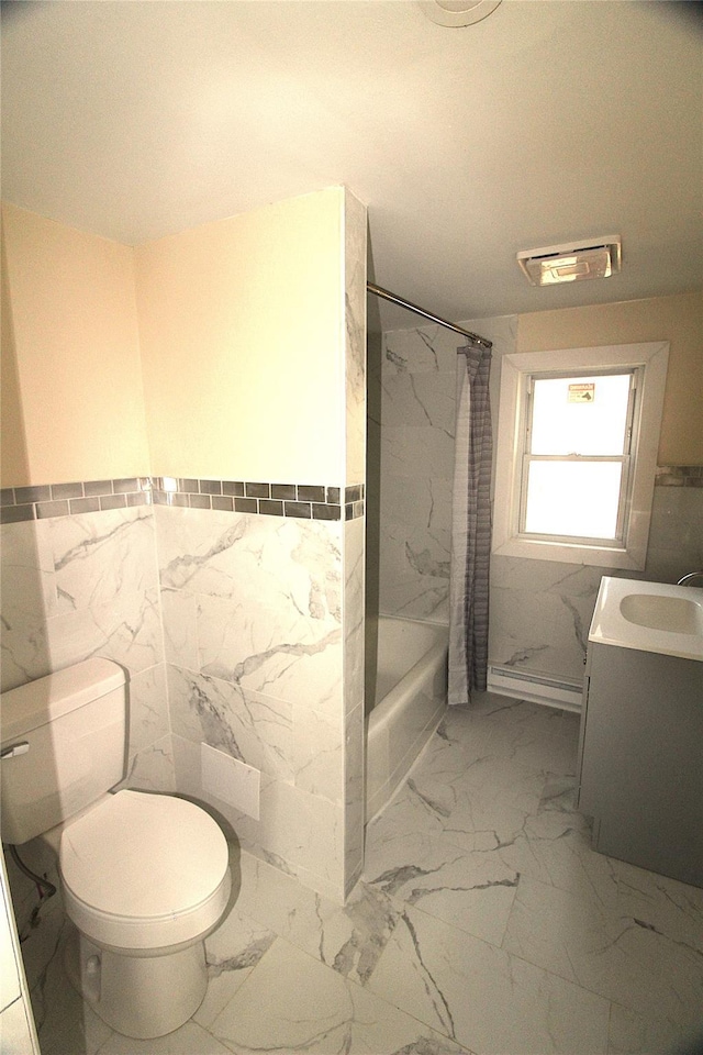 full bathroom featuring shower / bath combo, vanity, toilet, and tile walls