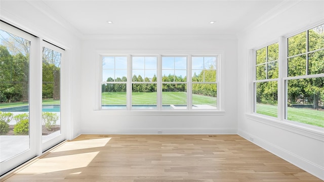 unfurnished sunroom with plenty of natural light