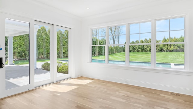 unfurnished sunroom featuring plenty of natural light