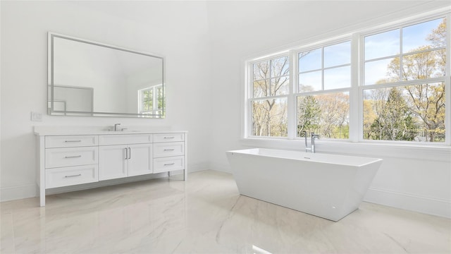 bathroom with vanity and a tub to relax in