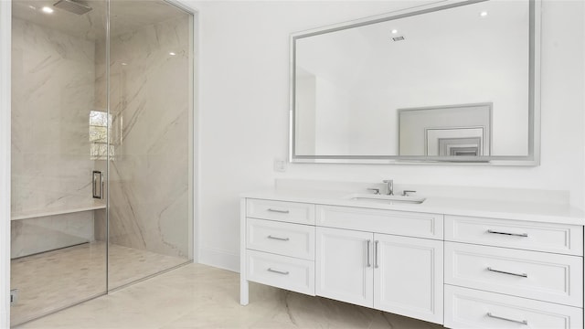 bathroom with vanity and an enclosed shower