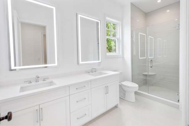 bathroom featuring tile patterned flooring, vanity, toilet, and an enclosed shower