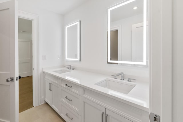 bathroom featuring vanity and wood-type flooring