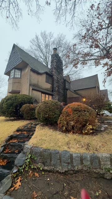 view of property exterior featuring a lawn