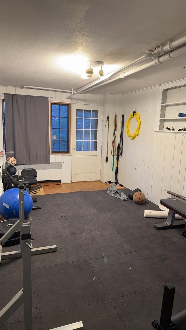 exercise area with a textured ceiling