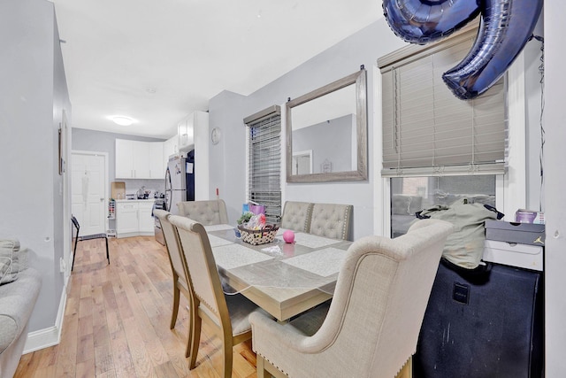 dining room with light hardwood / wood-style floors