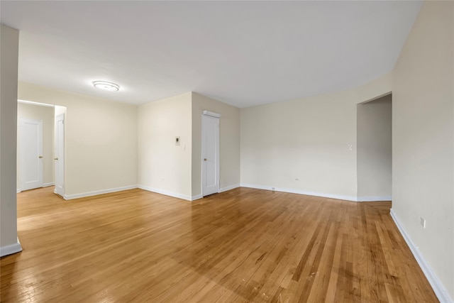 spare room featuring light hardwood / wood-style flooring