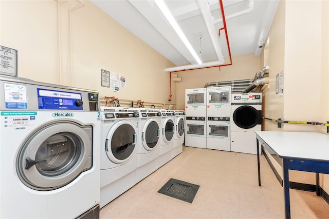 clothes washing area featuring stacked washer / drying machine and washing machine and clothes dryer