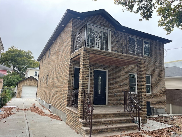 view of front of property featuring an outbuilding and a garage