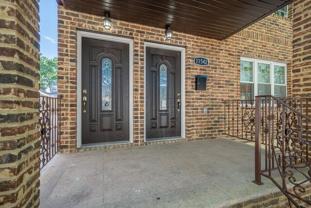 115-42 Inwood St, Jamaica, NY 11436 - property entrance featuring brick siding