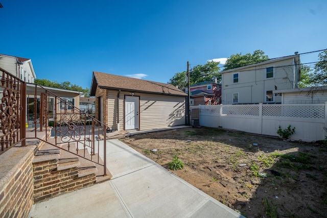 115-42 Inwood St, Jamaica, NY 11436 - view of yard featuring a patio and an outdoor structure
