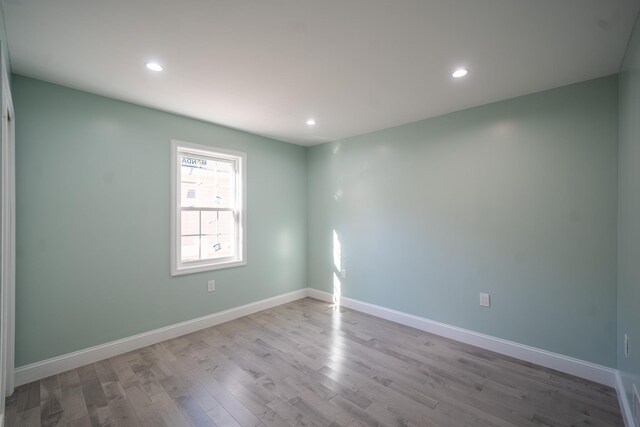 115-42 Inwood St, Jamaica, NY 11436 - empty room with wood finished floors, recessed lighting, and baseboards