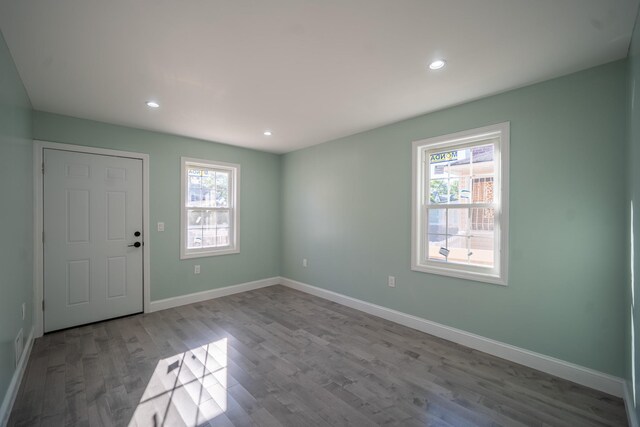 115-42 Inwood St, Jamaica, NY 11436 - foyer entrance with healthy amount of natural light, wood finished floors, baseboards, and recessed lighting