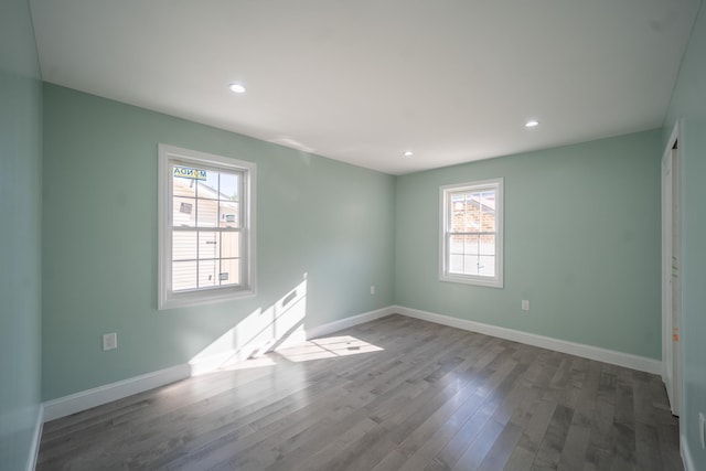 115-42 Inwood St, Jamaica, NY 11436 - unfurnished room with plenty of natural light, wood finished floors, baseboards, and recessed lighting