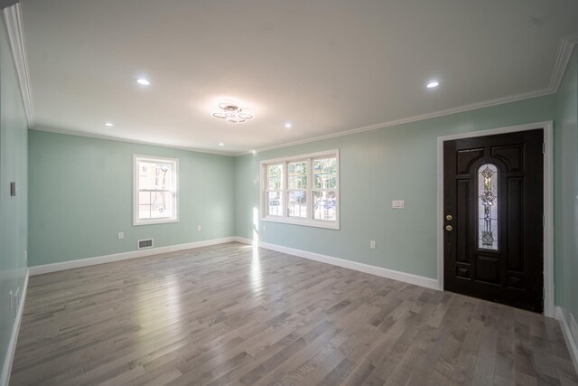 115-42 Inwood St, Jamaica, NY 11436 - entrance foyer featuring healthy amount of natural light, wood finished floors, baseboards, crown molding, and recessed lighting
