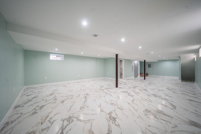 115-42 Inwood St, Jamaica, NY 11436 - below grade area with recessed lighting, baseboards, and light marble finish floors