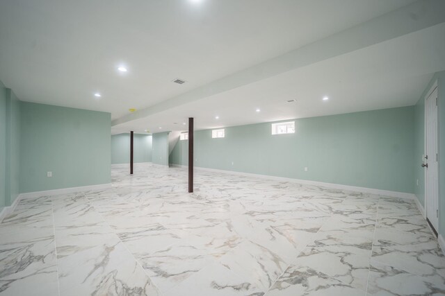 115-42 Inwood St, Jamaica, NY 11436 - basement with recessed lighting, baseboards, and light marble finish flooring