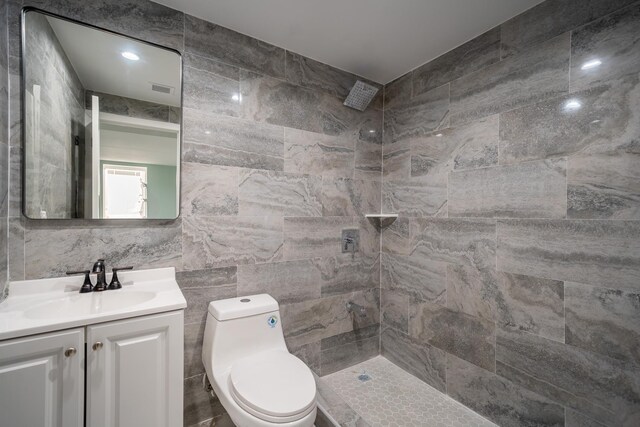 115-42 Inwood St, Jamaica, NY 11436 - full bath with tile walls, vanity, toilet, and tiled shower