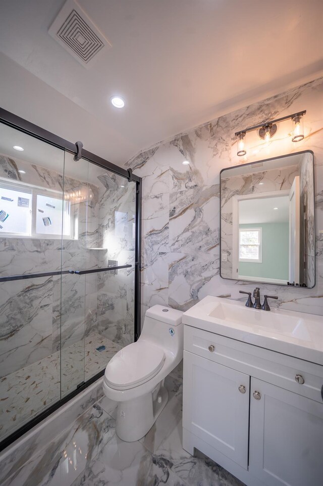 115-42 Inwood St, Jamaica, NY 11436 - full bathroom featuring a marble finish shower, toilet, vanity, marble tiled floors, and recessed lighting