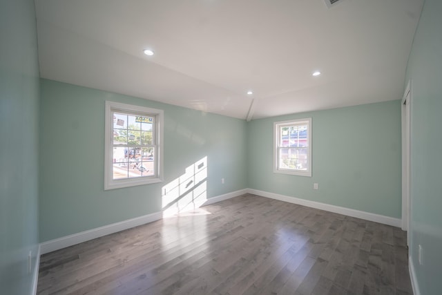 115-42 Inwood St, Jamaica, NY 11436 - empty room featuring healthy amount of natural light, wood finished floors, baseboards, and recessed lighting