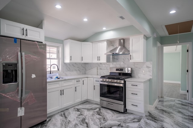 115-42 Inwood St, Jamaica, NY 11436 - kitchen featuring appliances with stainless steel finishes, wall chimney range hood, a sink, backsplash, and lofted ceiling