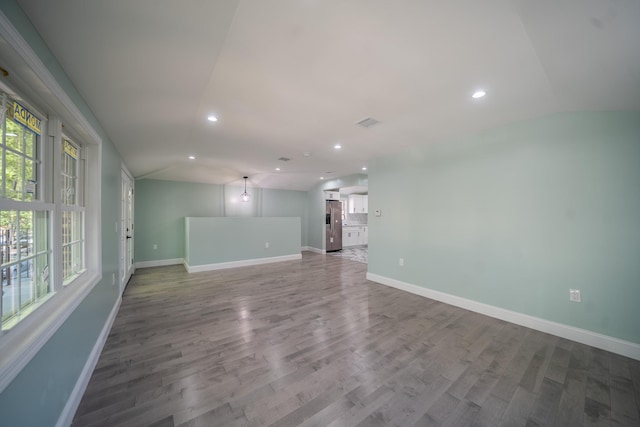 115-42 Inwood St, Jamaica, NY 11436 - unfurnished living room with recessed lighting, baseboards, and wood finished floors