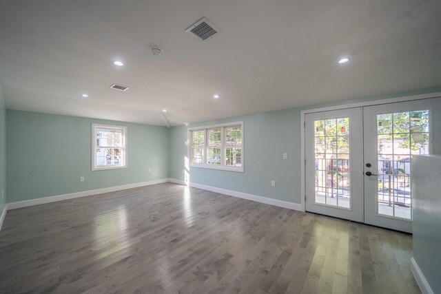 115-42 Inwood St, Jamaica, NY 11436 - unfurnished room featuring french doors, wood finished floors, baseboards, recessed lighting, and a smoke detector